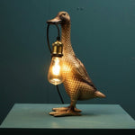 Werns Table Lamp Son of a Duck, gold, Poylresin/Metall, 18x23x44 cm